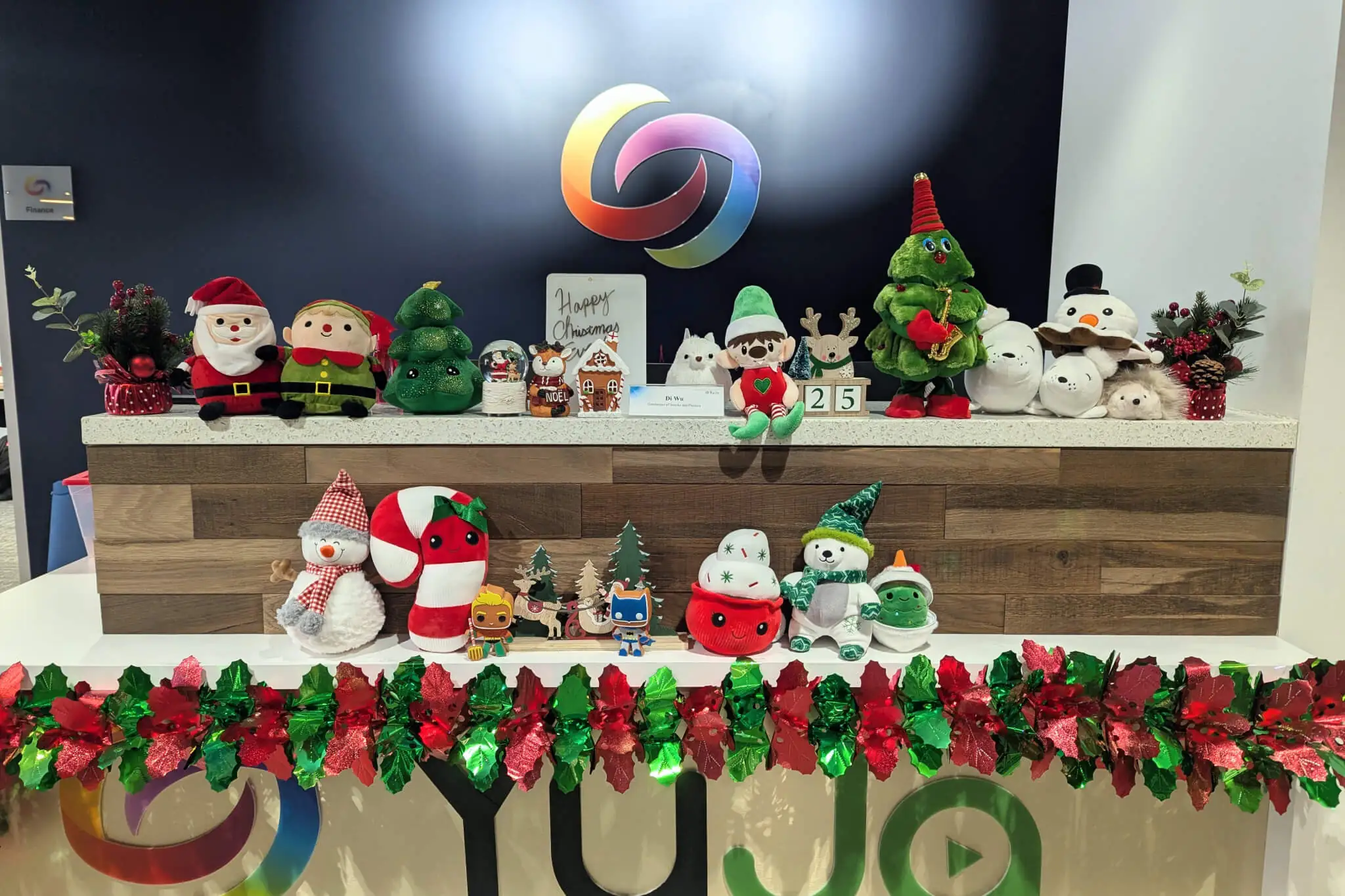 A festive display of Christmas decorations in a store, showcasing colorful ornaments and holiday cheer.