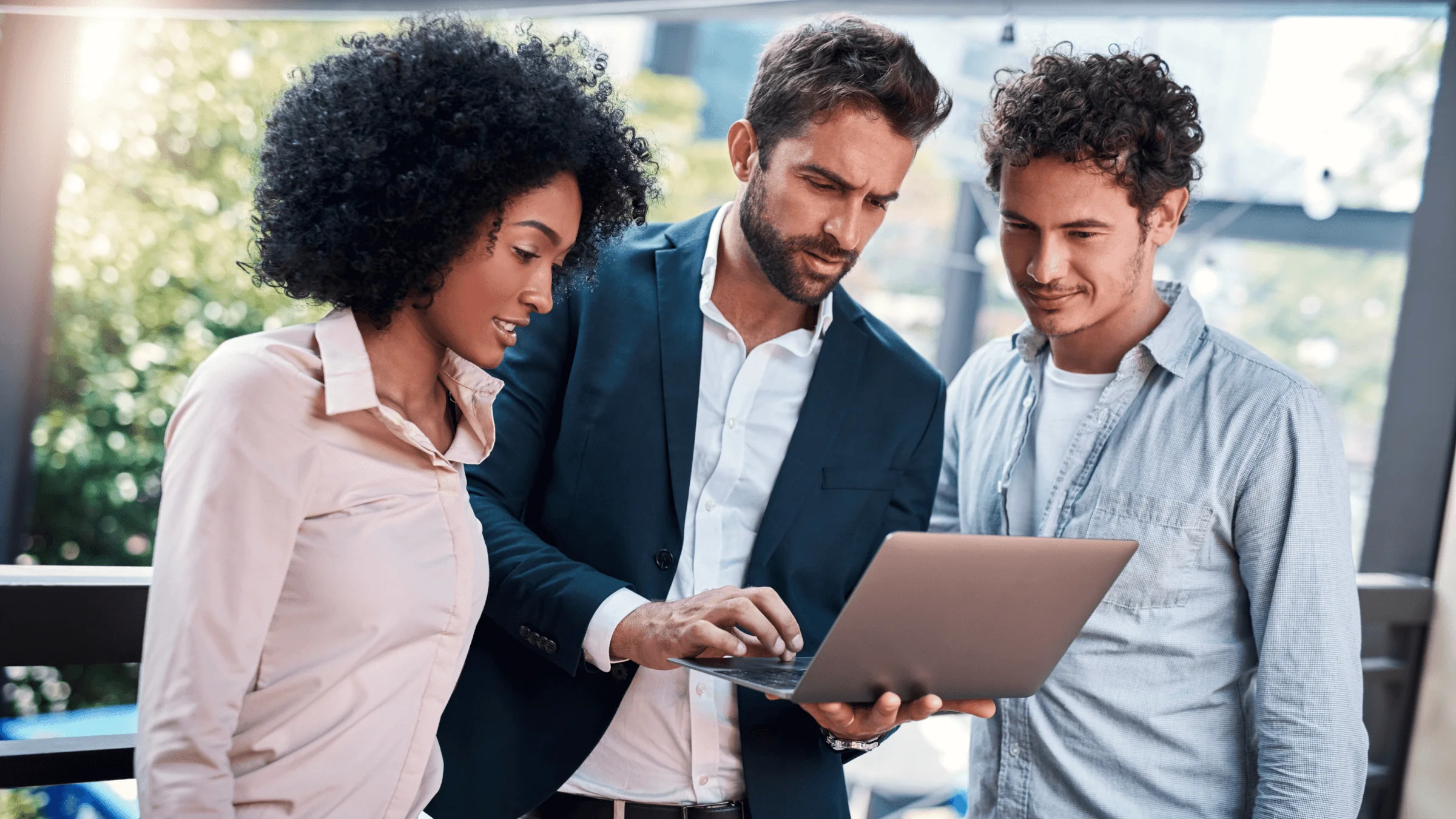 Business people looking at a computer.